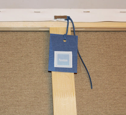 Close-up details of the back of the Blue Butterflies painting with the label reading "Pacoshabe", ready to hang